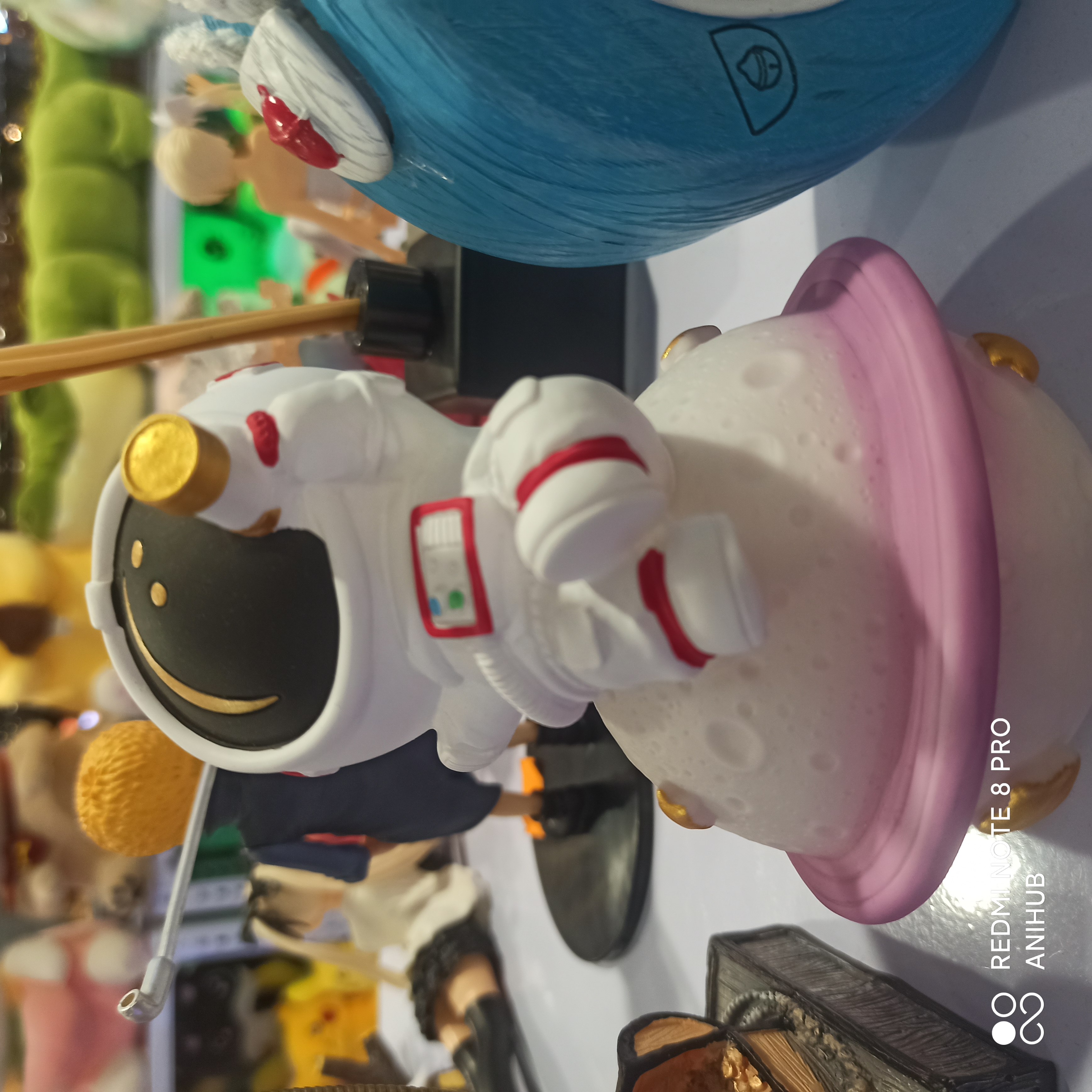 Spaceman Sitting on Space Lamp